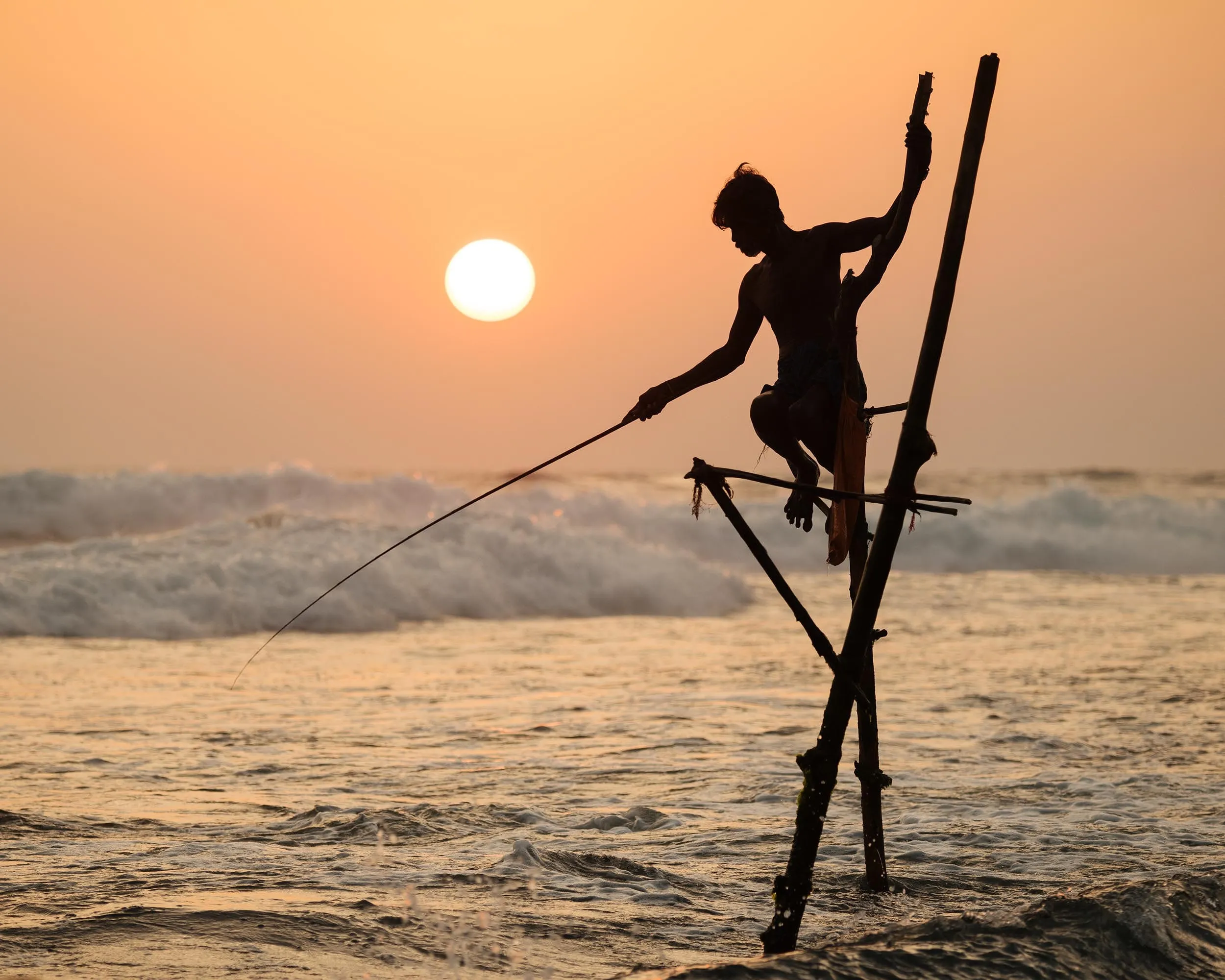 Traditional stilt fishermen on the southern coast of Sri Lanka near Galle